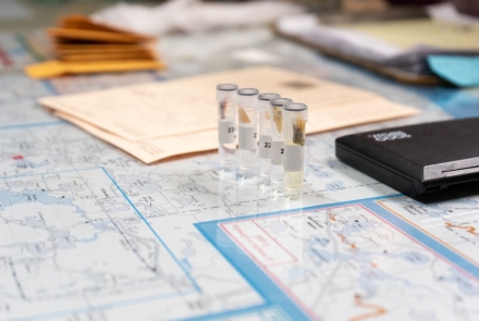 Four small tubes containing fish scales collected from harvested fish at the Northern Highland Fishery Research Area.