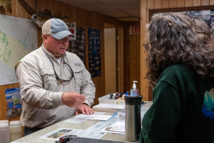 Creel station staff explain the NHFRA permit.