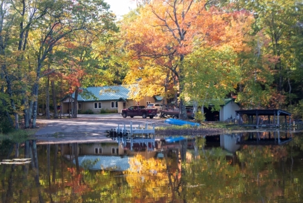 Beautiful fall colors or orange and yellow surround the Escanaba Lake Check Station.