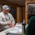 Creel station staff explain the NHFRA permit.