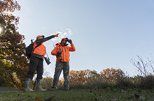 Couple scouts a field