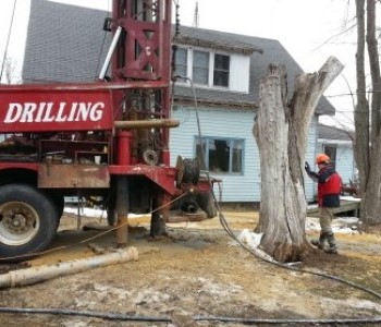 DNR Staff overseeing private well install