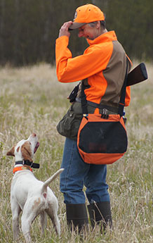 Hunter smiles down on pointer