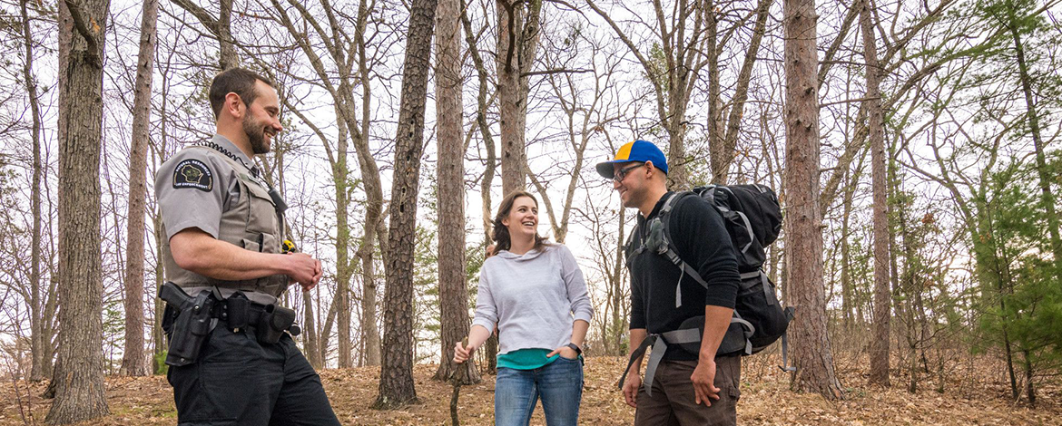 Warden and Hikers in the woods