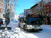 City bus driving on a snowy day